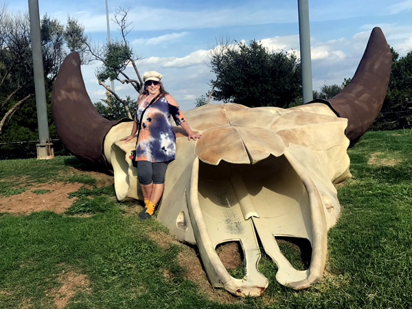 Karen Duquette beside the World's Largest Buffalo Skul