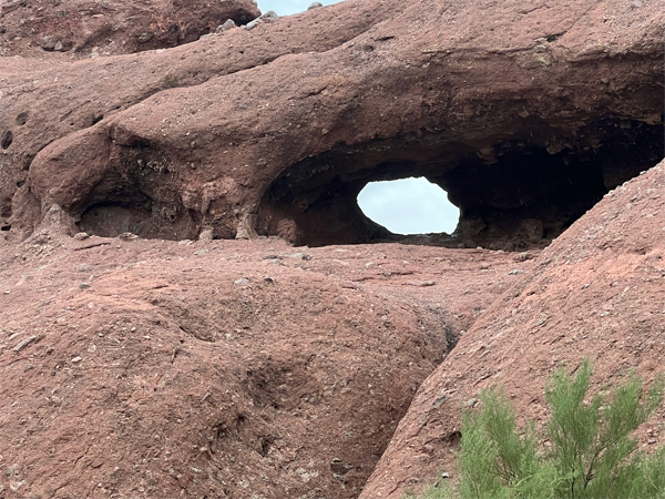 The upper hole in the rock