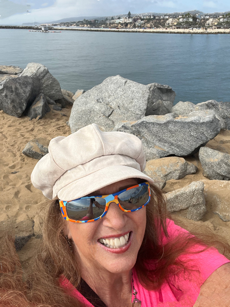 Karen Duquette on the rocks at the jetty