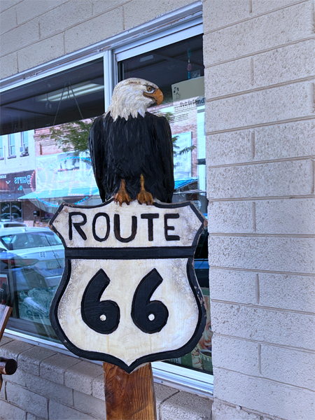 an eagle on a route 66 sign
