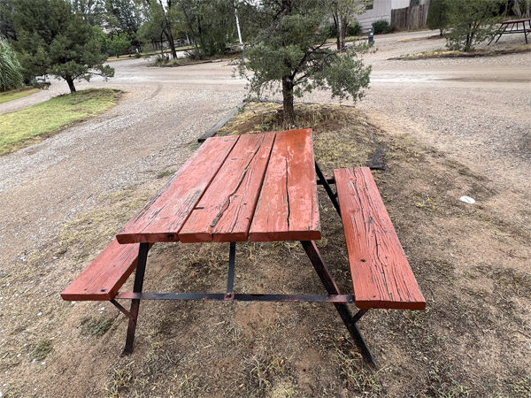 a picnic table in bad shape