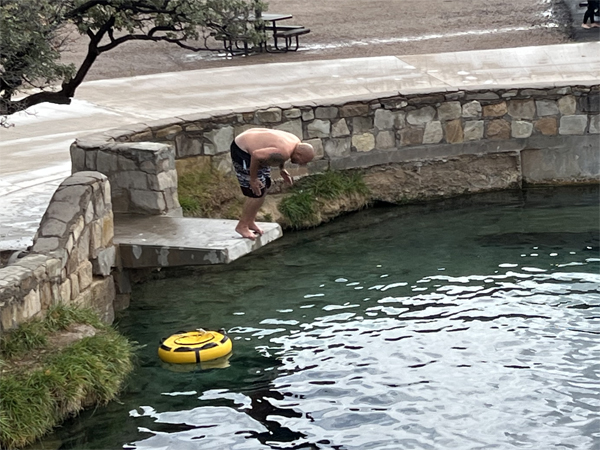 someone diving from the ledge