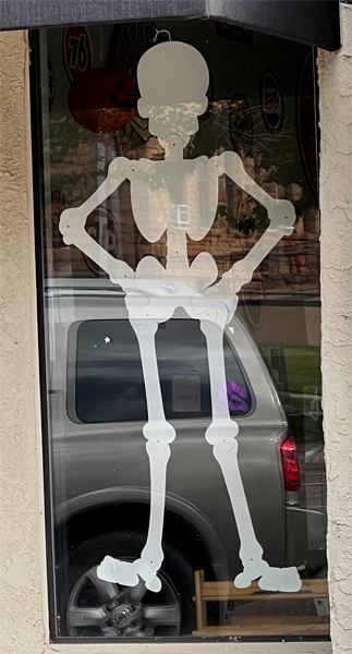 skeleton in a doorway