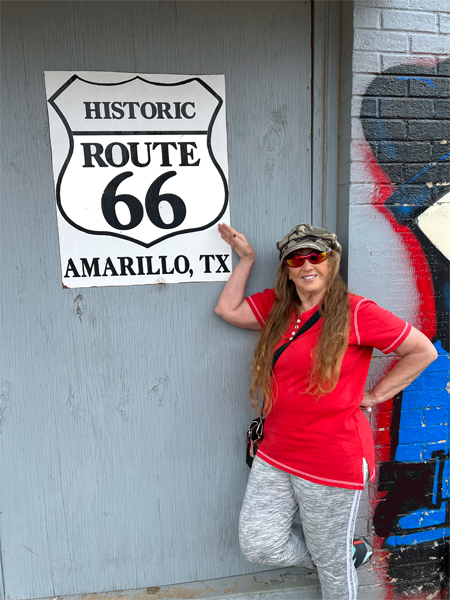 Karen Duquette and Historic Route 66 Amarillo sign
