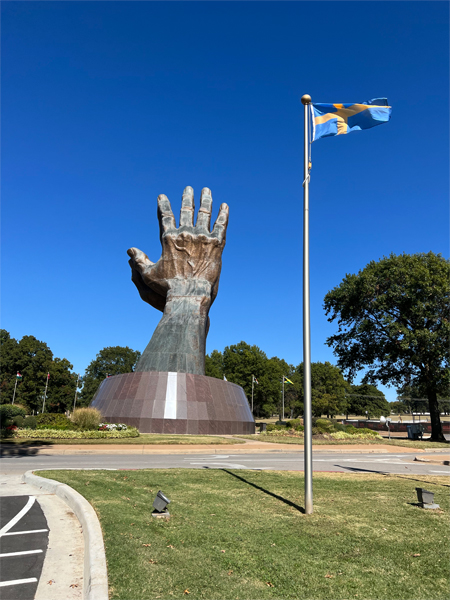 The Praying Hands and OK flag