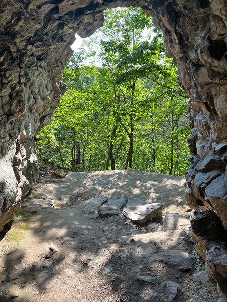 looking out from inside the cave