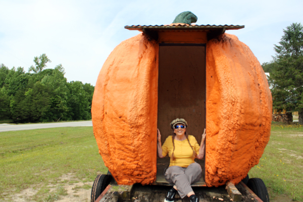 Karen Duquette inside the big pumpkin