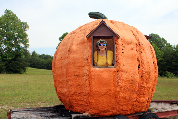 Karen Duquette inside the big pumpkin