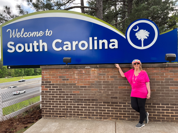 Karen Duquette at the Wel;come to South Carolina sign