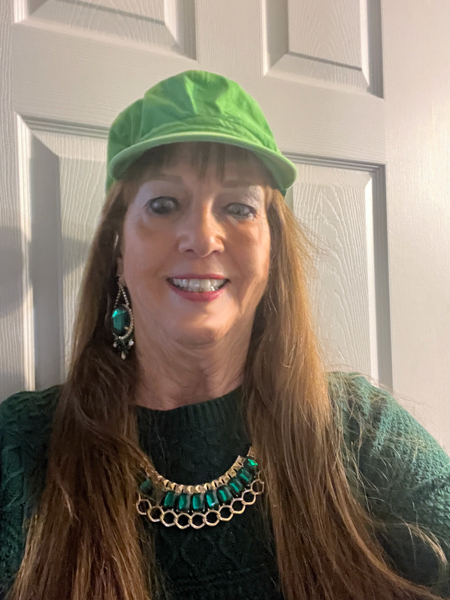 Karen Duquette in a lime green hat