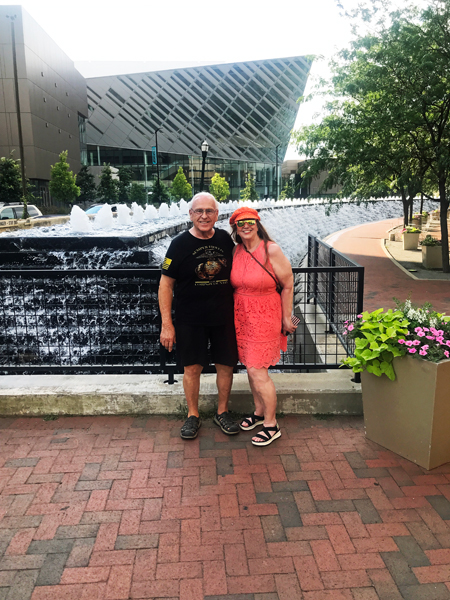 ee and Karen Duquette by the water wall