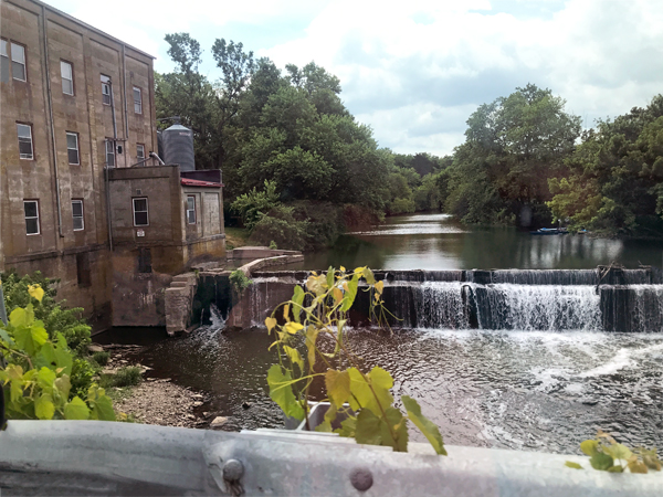 old building and flowing water fall