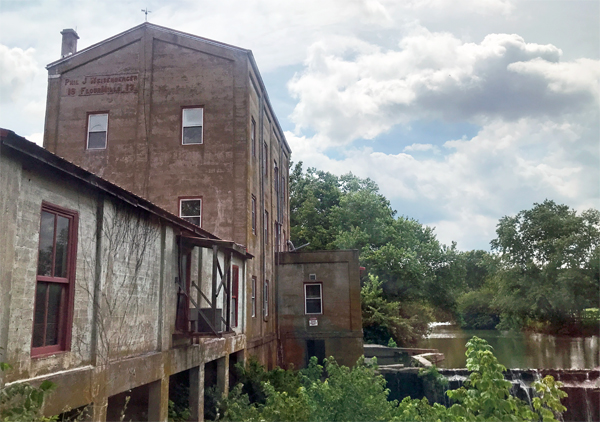 old building and flowing water fall