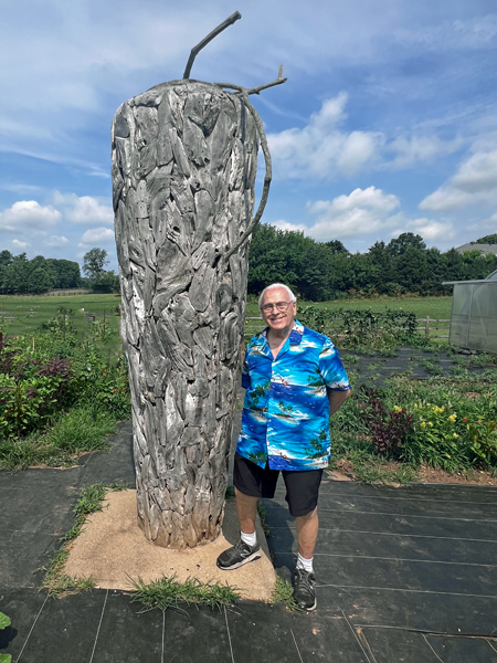 Lee Duquette by a giant Luffa Gourd