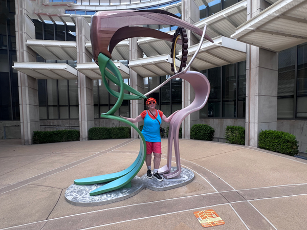 Karen Duquette with the Mother and Daughter sculpture