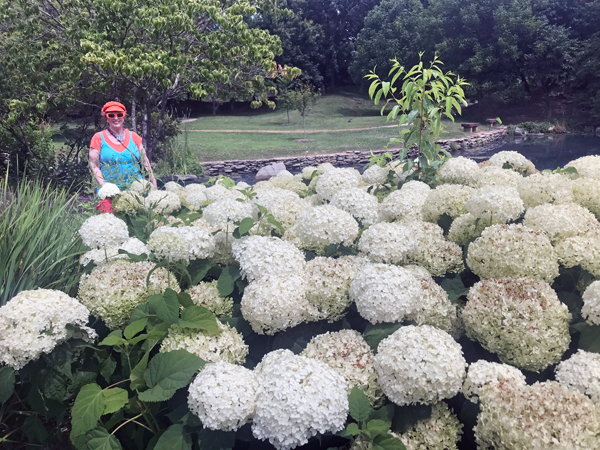 Karen Duquette by the flowers