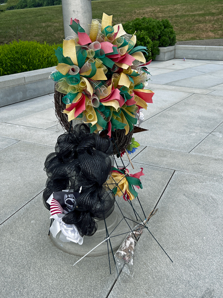 flowers by the flag pole