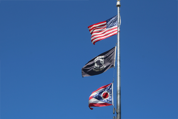 USA flag, POW flag, and the Ohio state flag