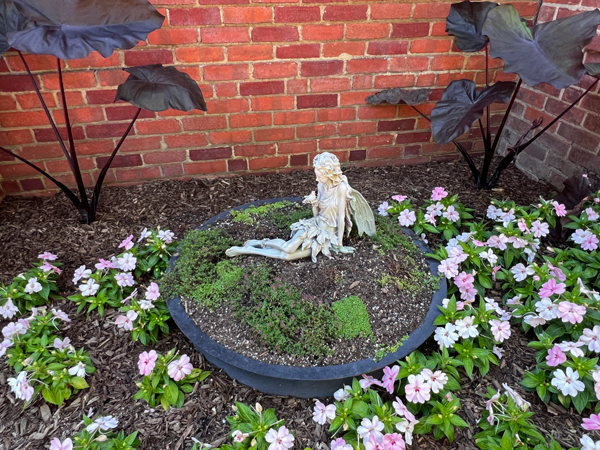 Angel statue with a bird in hand