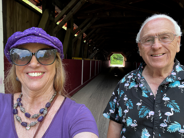 Karen and Lee Duquette inside McGees Mills Covered Bridge