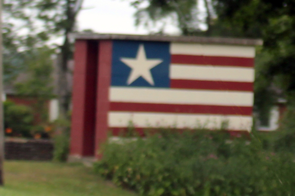 small building painted like a flag