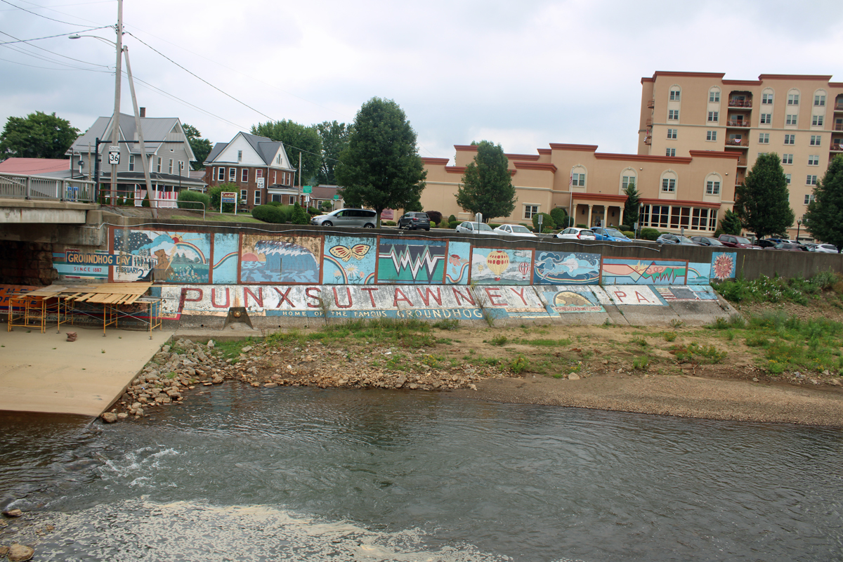 Punxsutawney mural on right side of bridge.