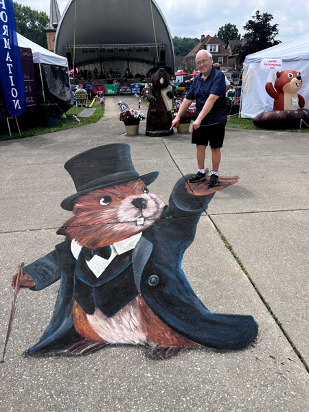 Punxsutawney Phil holding Lee Duquette