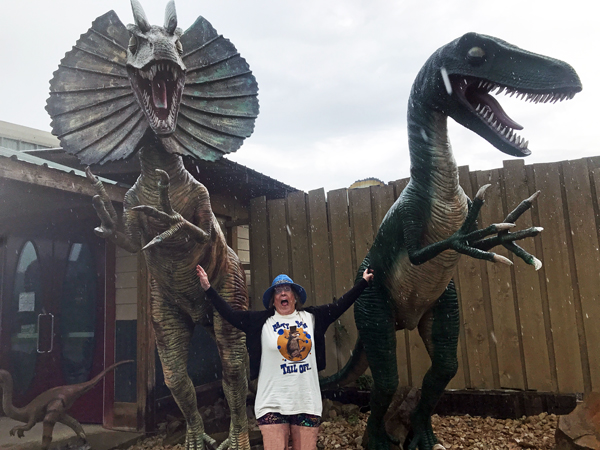 dinosaurs attacking Karen Duquette