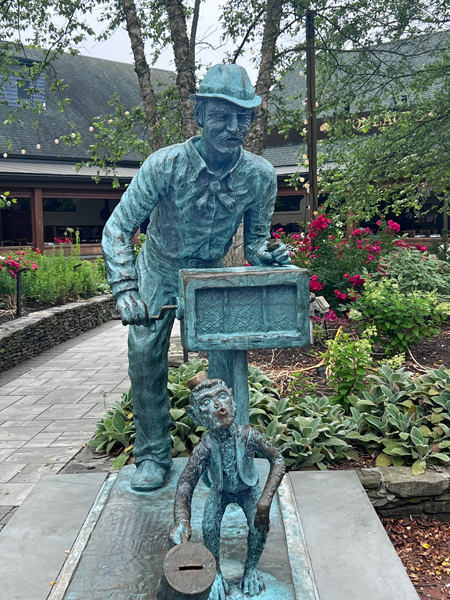 Life-size bronze organ grinder and a goofy monkey