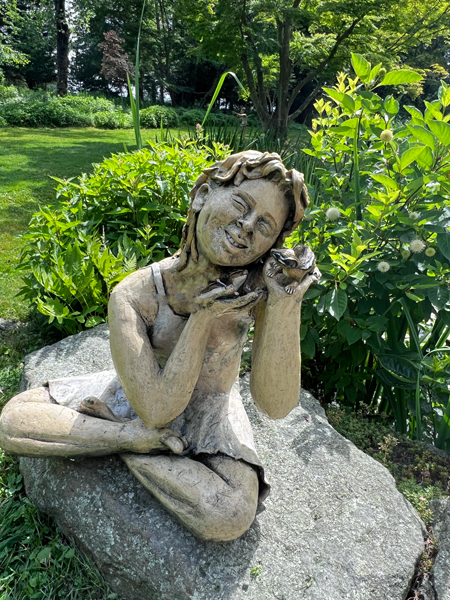 girl with wildlife statue