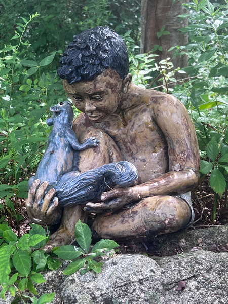 boy with critters in the nature