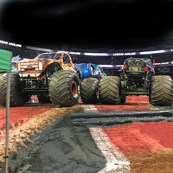 4 monster trucks on the hill