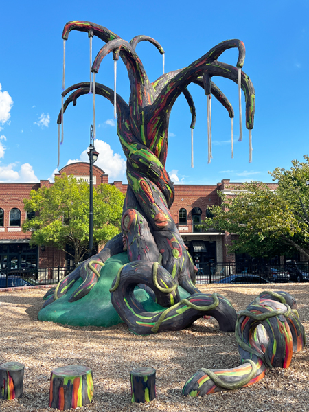 colorful sculptured tree and slide