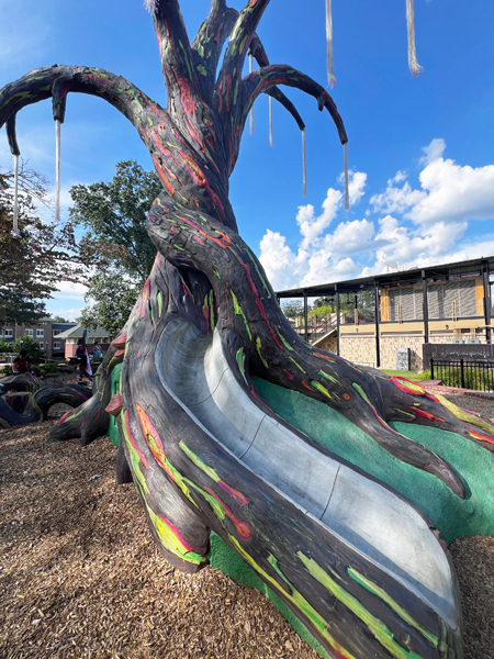 colorful sculptured tree and slide