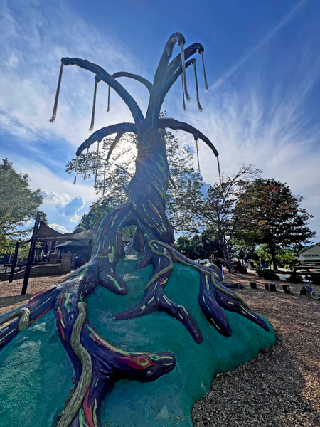 colorful sculptured tree and slide