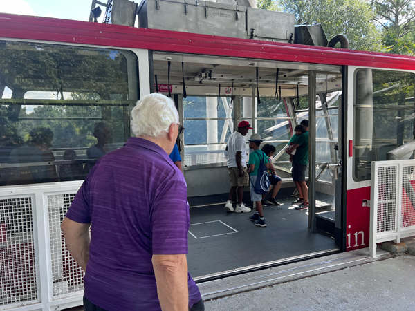 Lee Duquette entering the Skyride aerial tram