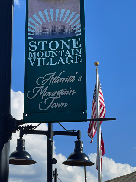 Stone Mountain Village flag and a USA flag