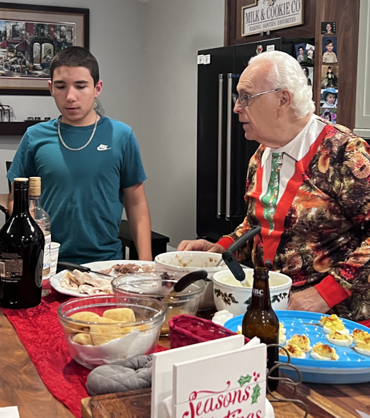 Anthony and his great-grandfather at the food table