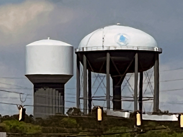 two side-by-side watertowers