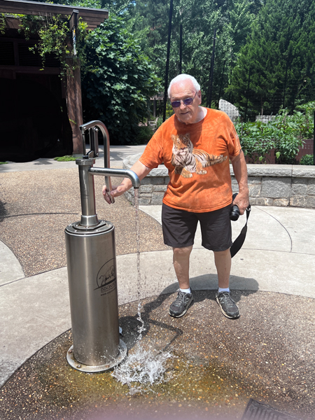 Lee Duquette at a water pump