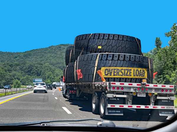 truck hauling very big over-sized ites