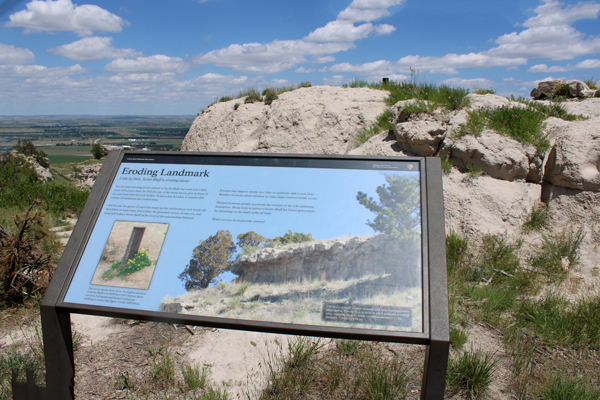 Eroding landmark informative sign