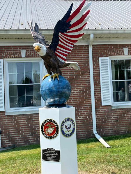 Eagle, globe and Mrine Corps and Navy emblems