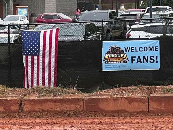 USA Flag and Welcome Fans sign