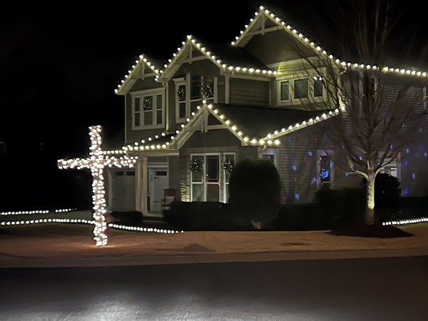 house in white and a cross