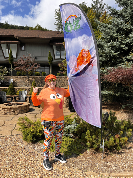 Karen Duqette at the Land of OZ banner