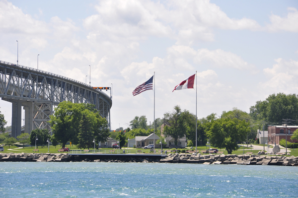 the USA and Canadian flags on the USA side of the Bluewater Bridge