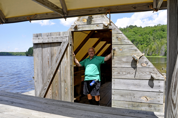 Lee Duquette in the doorway of the Wanigan