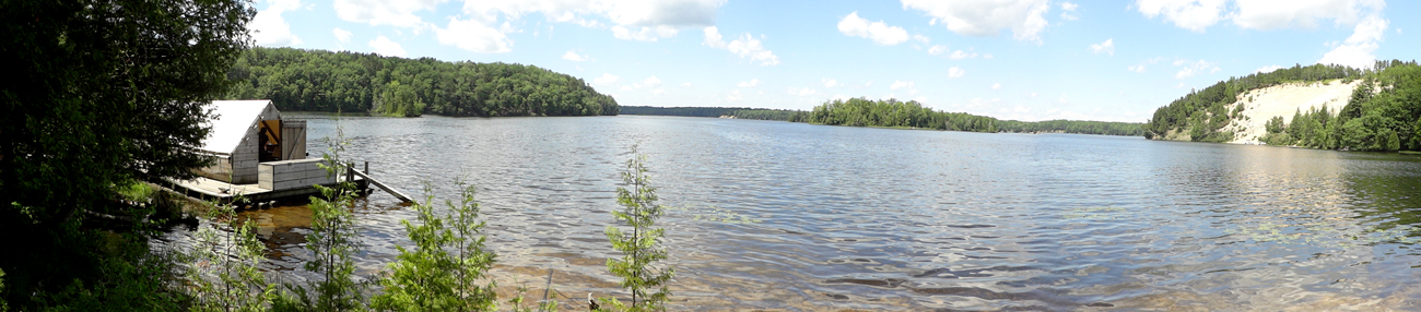 A replica of a Wanigan, horseshoe island and the Au Sable River
