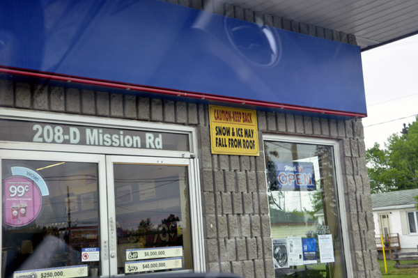 a funny sign by the door of a store